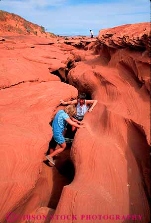 Stock Photo #12800: keywords - adventure antelope arizona canyon canyons child climb climbing daughter deep deposit deposition erode eroded erodes eroding erosion explore exploring formation formations geologic geological geology girl hike hiking in layer layered layers mother natural nature outdoor outside page parent red released rock sandstone sculpted sculptures sediment sedimentary single slot southwest steep strata stratum summer vert walk walking wall walls warm woman