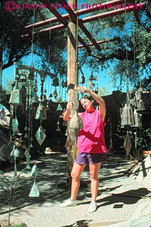 Stock Photo #9055: keywords -  arid arizona bell bells climate community cosanti desert destination display dry hot looks merchandise metal phoenix released resort resorts retail scottsdale southwest southwestern sunny travel vert warm west western woman