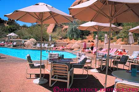Stock Photo #9065: keywords - arid arizona boulders climate community desert destination dry horz hot phoenix pool relax relaxed relaxes relaxing resort resorts scottsdale silhouette silhouettes southwest southwestern sunny swim swimming travel umbrellas vacation warm west western