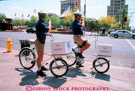 Stock Photo #11799: keywords -  arizona assist assistance assisting bicyclers bicycles bicycling bike bikers bikes direct direction downtown free help helper helpers helping horz info information men mobile people phoenix portable public service southwest west western