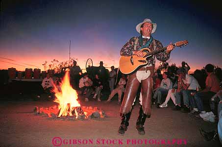 Stock Photo #12736: keywords - adventure arizona camp campfire camps cowboy cowboys dark dude entertain entertainer entertaining entertainment evening family fire group guest guests guitar horz inn outdoor outside people perform ranch ranches resort resorts show sing singer singing sings song southwest vacation vacationing vacations voice west western wickenburg