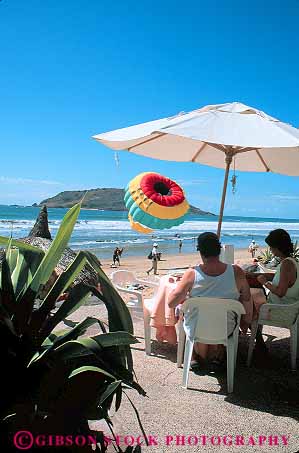 Stock Photo #12817: keywords -  beach cafe cafes cid coast coastal country couple couples destination dine dining eat eating el foreign hotel mazatlan mexico patio relax relaxes relaxing resort resorts travel tropical umbrella vacation vacations vert warm
