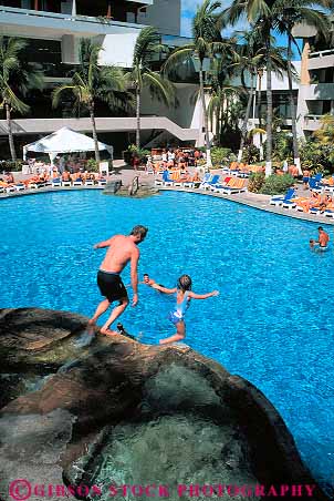 Stock Photo #12818: keywords - beach child cid coast coastal country daughter destination el father foreign fun girl hotel into jump mazatlan mexico parent play playing pool pools resort resorts swim swimming travel tropical vacation vacations vert warm