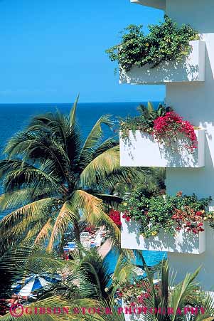 Stock Photo #12824: keywords -  apartment apartments balconies building coast coastal condo condominium condominiums condos country destination elevate elevated flowers foreign mexico ocean puerto resort resorts travel tropical vacation vacations vallarta vert view views