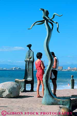 Stock Photo #12831: keywords -  art barque coast coastal country couple couples destination foreign malecon metal mexico public puerto resort resorts sculpture sculptures travel tropical vacation vacations vallarta vert