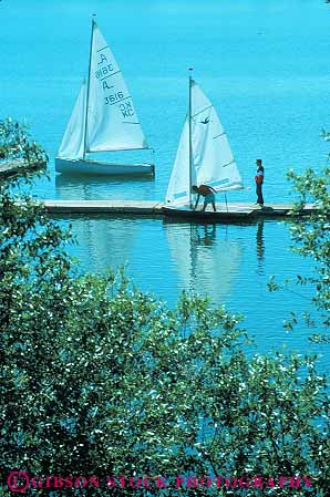 Stock Photo #12122: keywords -  alberta calgary canada dock docks fun glenmore lake lakes people play playing recreation sail sailboat sailboats sailing season summer vert