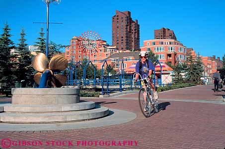 Stock Photo #12123: keywords -  alberta bicycle bicycling bicyclist bike biking calgary canada claire district eau fun horz peddle peddling people play playing recreation roll rolling season summer through woman women