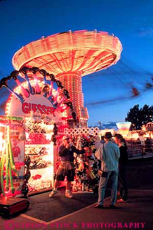Stock Photo #12134: keywords - activity alberta amusement annual calgary canada dark dusk evening event events fair fairs festival festivals gathering guesser lighting lights midway night park season social stampede summer vert