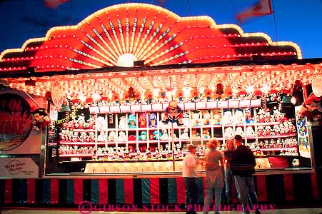 Stock Photo #12135: keywords - activity alberta annual bright calgary canada color colorful dark dusk evening event events fair fairs festival festivals game games gathering horz lighting lights midway night social stampede