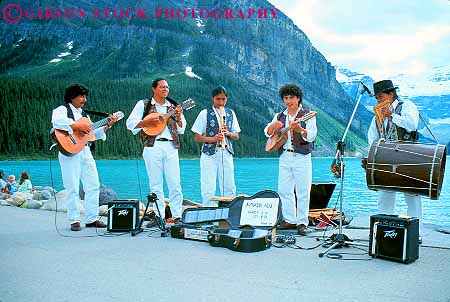 Stock Photo #12485: keywords - alberta andian banff canada display dress ethnic foreign group groups horz lake lakes landscape louise men mountain mountains music musician musicians national outdoor outside park parks perform performance performers performing public scenery scenic show shows sound wilderness young