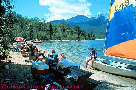Stock Photo #12091: keywords -  alberta beach beaches boat canada destination horz jasper lake lakes mountains national park parks people public pyramid relaxing rocky sail season small summer sunny sunshine swim travel water