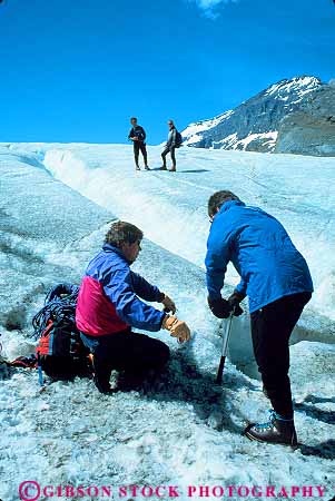 Stock Photo #12092: keywords -  alberta athabasca canada climbing cold crevasse destination downhill equipment explore exploring freeze freezing frozen glacier glaciers hike hikers hiking ice icy jasper men mountains national park parks people public recreation research researchers researching rocky slope test travel valley vert walk walking