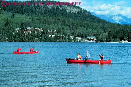 Stock Photo #12497: keywords - alberta boat boating calm canada canoe canoeing canoes children exercise families family father fun horz jasper lake lakes mountain mountains national natural nature parent park people pyramid recreation red rocky single