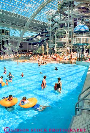 Stock Photo #18703: keywords -  activities activity alberta big canada cover covered edmonton enclose enclosed giant huge indoor indoors inside large mall park parks people person play playing plays pool pools recreation sport swim swimming vert water waterpark waterparks west world