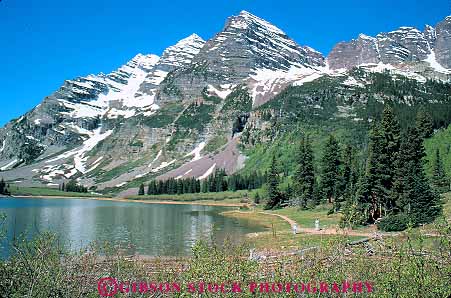 Stock Photo #12840: keywords -  alpine aspen bells calm colorado crater forest hiker hikers hiking horz lake lakes landscape landscapes maroon mountain mountains nature near of outdoor outside peaceful peak people recreation rocky rugged scenery scenic shore snow steep wild wilderness