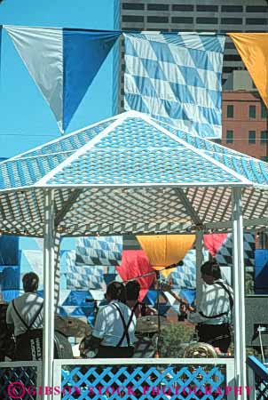 Stock Photo #11039: keywords - activity angle angles annual building celebrate celebrates celebrating celebration cities city colorado denver design downtown event events fair fairs festival festivals gather gathering gazebo gazebos geometric geometrical geometry grid holiday larimer lattice music october oktoberfest party people pyramid pyramids shape shapes square triangle triangles urban vert