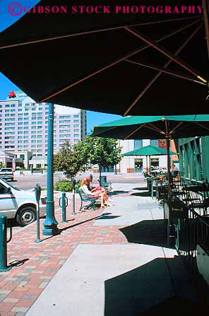 Stock Photo #12702: keywords -  cafe cafes cities city colorado downtown mountain restaurant rocky shade sidewalk springs street umbrellas urban vert