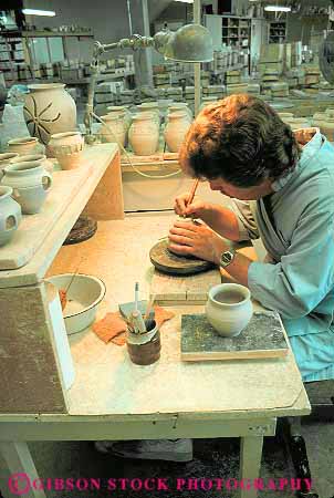 Stock Photo #12707: keywords - briggle careful clay colorado craft crafter crafting crafts craftsman craftsmen detail employee female hand handmade hands indoor inside job man occupation pot pots pottery sit sits sitting skill skilled springs van vert work worker working works