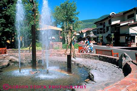 Stock Photo #12584: keywords -  bike colorado community couple destination downtown fountain fountains horz mountain mountains resort resorts rocky summer tandem town travel vail