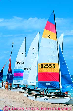 Stock Photo #11409: keywords -  beach beaches boat boats catamaran coast color colorful destination florida fort lauderdale ocean recreation resort sail sailboat sailboats sails sea shape shapes summer sunny travel triangle triangles tropical vacation vert warm