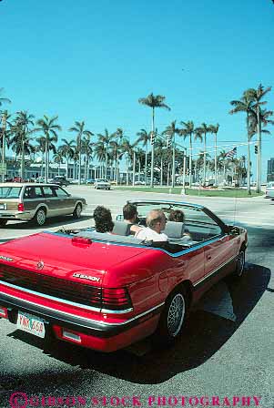 Stock Photo #11757: keywords -  auto automobile automobiles autos beach car cars convertible destination drive driver driving florida fun in palm passenger passengers people resort resorts roof roofs street streets sunny sunshine transportation travel vacation vert warm