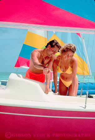 Stock Photo #11510: keywords - bathing beach beaches beautiful beauty boat boats colorful couple destination florida handsome health healthy husband look lover lovers man miami people pretty released resort sailboat share skin suit tan team together travel tropical vacation vert wife woman