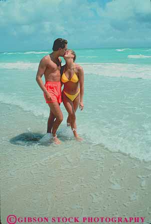 Stock Photo #11541: keywords -  affection affectionate along beach beaches coast coastal couple couples destination embrace embracing florida fun hug hugging intimacy intimate love lovers loving man miami ocean outdoor outside pair people play playing recreation released sane sea share shore shoreline stroll strolling strolls surf travel vert walk walking waves woman