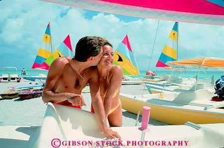 Stock Photo #11542: keywords - affection affectionate beach beaches boats coast coastal couple couples destination embrace embracing florida fun horz hug hugging intimacy intimate kiss kisser kisses kissing love lovers loving man miami ocean outdoor outside pair people play playing recreation released sane sea share shore shoreline surf travel waves woman