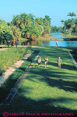 Stock Photo #11543: keywords -  botanical boy boys child children destination exercise exercising fairchild florida fun garden green lawn miami outdoor outside people play playing recreation run runner running runs travel tropical vert