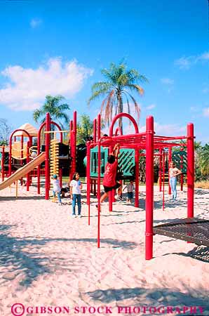 Stock Photo #11545: keywords -  child colorful destination equipment ethnic florida fun in kid kids metrozoo miami minority modern new outdoor outside people play playground playgrounds playing recreation sand travel vert