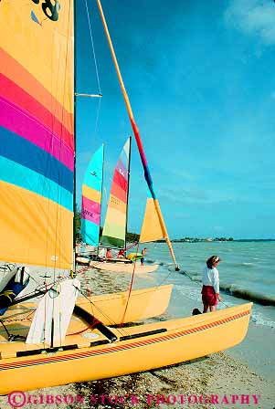 Stock Photo #11549: keywords -  beach beaches boat boats catamarans coast coastal colorful florida miami ocean sail sailboat sailboats sea shore shoreline vert water yellow