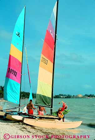 Stock Photo #11550: keywords -  beach beaches boat boats catamarans coast coastal colorful florida miami ocean sail sailboat sailboats sea shore shoreline vert water yellow