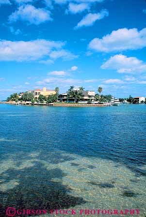 Stock Photo #11558: keywords - biscayne canal coast florida home homes house houses key miami neighborhood ocean shore vert water waterfront