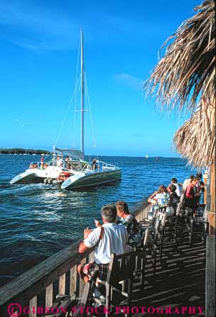 Stock Photo #9498: keywords -  boat boats cafe cafes catamaran cocktail cocktails destination florida islands key keys ocean past people pier relax relaxed relaxing resort resorts sail sailing sails sea sunset travel tropic tropical vacation vert water west