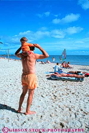 Stock Photo #9505: keywords - affection beach beaches bond bonding carry child destination father florida fun hold islands key keys kid lift lifting love loving play resort resorts shoulders sunbathing sunny touch travel tropic tropical vacation vert warm west