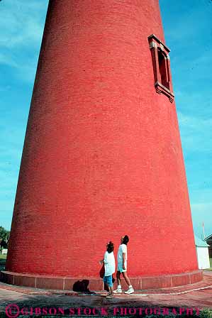 Stock Photo #12866: keywords -  (near beach beach) brick building circular coast coastal couple cylinder cylindrical daytona destination florida inlet leisure lighthouse lighthouses look looking near ocean people ponce red round see seeing shore shoreline south sunny sunshine tall travel up upward upwards vacation vert view viewing walk walking