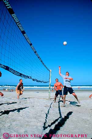Stock Photo #12876: keywords -  athletic ball beach beaches coast coastal daytona destination florida fun leisure man men net ocean outdoor outside play players playing recreation resort resorts sand shore shoreline south sport sports sunny sunshine team travel vacation vert volleyball