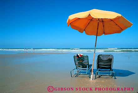 Stock Photo #12877: keywords -  and beach beaches calm chair chairs clean coast coastal daytona destination florida horz leisure ocean open recreation resort resorts sand shade shore shoreline south space sunny sunshine surf travel umbrella umbrellas vacation water yellow