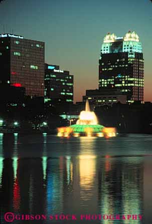 Stock Photo #8284: keywords -  building buildings color colored dark destination dusk eola evening florida fountain high lake lighting lights modern night office orlando reflection rise sunset travel usa vacation vert