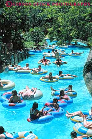Stock Photo #8305: keywords - activities activity amusement castaway creek crowd crowded destination disneyworld drift family float floating floats florida fun group inner lagoon leisure orlando park people play playing relax resort resorts stream swim swimmer swimmers swimming travel tube tubes typhoon usa vacation vert water