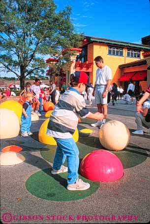 Stock Photo #8316: keywords - activities activity amusement children color colorful destination disney disneyworld families family florida fountain fun in intermittent leisure orlando periodic play playing resort resorts spray tourist tourists travel travelers usa vacation vert village water