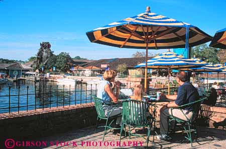 Stock Photo #8318: keywords -  activities activity amusement attraction cafe cafes destination dine dining disney disneyworld eat eating families family florida food fun horz leisure orlando outdoor outside patio patios play playing resort resorts restaurant restaurants shade share together tourist travel travelers umbrella umbrellas usa vacation village