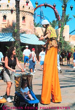 Stock Photo #8345: keywords - activities activity adventure amusement attraction costume costumed destination eisure families family florida fun islands l of orlando park people play resort resorts stilt stilts studios tall tourist travel universal usa vacation vert woman