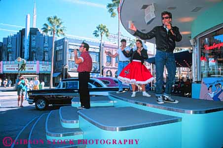 Stock Photo #8355: keywords -  activities activity amusement attraction coordinate coordinated costume costumed destination dinner entertain entertaining entertainment entertains era families family florida fun group harmonize harmony high horz leisure music musicians orlando park people perform performance performing performs play resort resorts rock roll show sing singers singing sixties sixty stage studios synchronize synchronized team tones tourist travel universal usa vacation