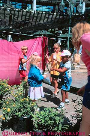Stock Photo #12153: keywords - activity annual butterflt butterfly celebrates celebration child children day earth enclosure event fair fairs festival festivals florida group groups hold in jacksonville landing people see touch touching vert