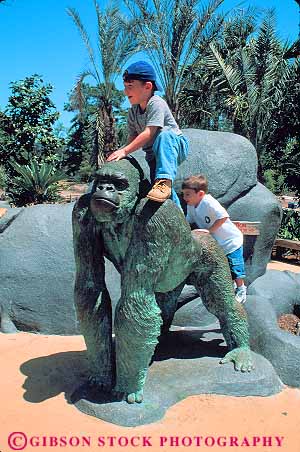 Stock Photo #12157: keywords - ape apes boy boys child children climb climbing climbs florida gorilla jacksonville metal sculpture sculptures season summer vert zoo zoos