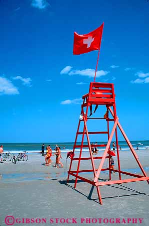 Stock Photo #12159: keywords -  aid beach beaches blue calm chair chairs coast coastal colorful first flag flags florida frame framed hot jacksonville lifeguard lifeguards ocean paint painted people red sand shore shoreline sky stand summer sunny sunshine vert warm water wood wooden