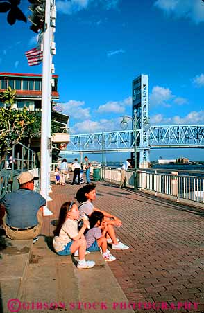 Stock Photo #12163: keywords -  asian child children cone cones cream ethnic families family father florida husband ice jacksonville landing minority mother relax relaxing season sit sits sitting summer tourist tourists vert wife