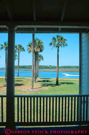 Stock Photo #12166: keywords -  architecture boat boats buildings design florida jacksonville kingsley motorboat outboard passing plantation plantations porch porches rail railing river style traditional vert water