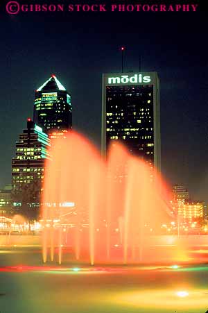 Stock Photo #12167: keywords -  architecture buildings cities city cityscape cityscapes color colorful dark design downtown florida fountain fountains friendship high jacksonville lighting lights new night office orange rise skyline skylines splash splashes spray sprays style urban vert water